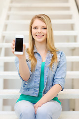 Image showing smiling student with smartphone blank screen