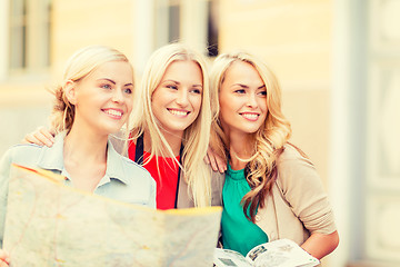 Image showing beautiful women with tourist map in the city