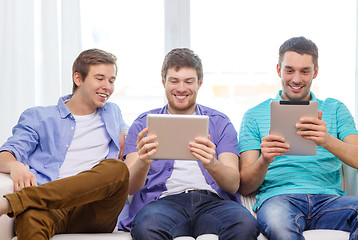 Image showing smiling friends with tablet pc computers at home