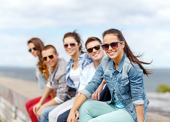 Image showing smiling teenage girl hanging out with friends