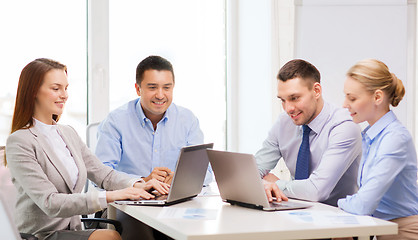 Image showing business team working with laptop in office