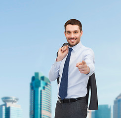 Image showing handsome buisnessman with jacket over shoulder