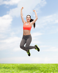 Image showing sporty teenage girl jumping in sportswear