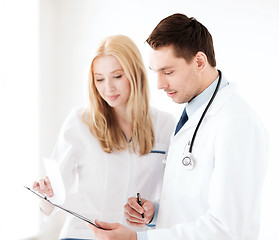 Image showing two doctors writing prescription