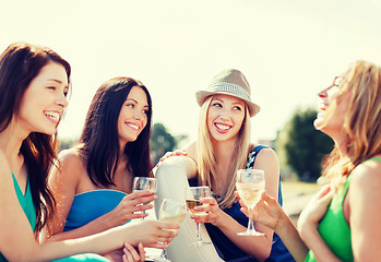 Image showing girls with champagne glasses on boat