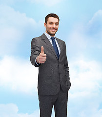 Image showing handsome buisnessman showing thumbs up