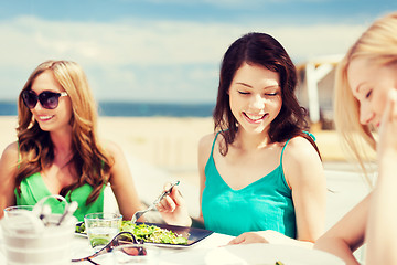 Image showing girls in cafe on the beach