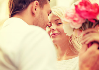 Image showing couple with flowers in the city