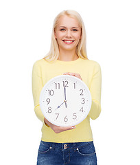 Image showing student with wall clock