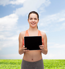 Image showing sporty woman with tablet pc blank screen