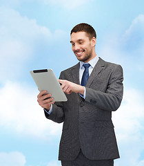 Image showing smiling buisnessman with tablet pc computer