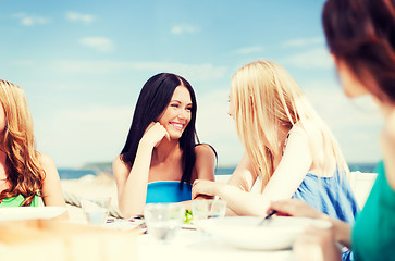 Image showing girls in cafe on the beach