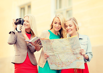 Image showing women with tourist map and camera in the city