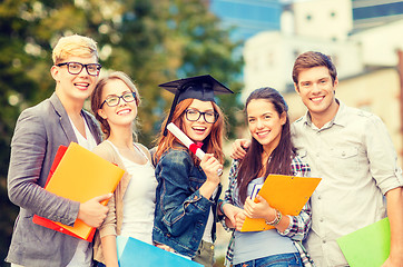Image showing students or teenagers with files and diploma