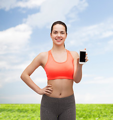 Image showing sporty woman with smartphone