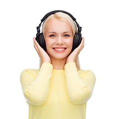 Image showing smiling young woman with headphones