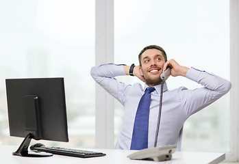 Image showing smiling businessman or student with computer