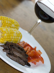 Image showing skirt steak with corn and red peppers