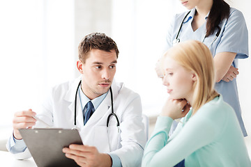 Image showing doctor and nurse with patient in hospital