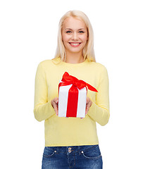 Image showing smiling girl with gift box