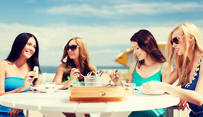 Image showing girls in cafe on the beach