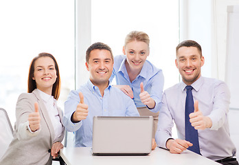 Image showing business team working with laptop in office