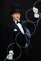 Image showing magician showing trick with linking rings
