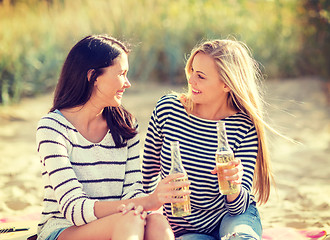 Image showing girls with drinks on the beach