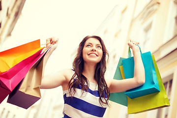 Image showing beautiful woman with shopping bags in the ctiy