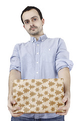 Image showing Young man holding a present