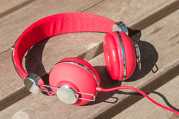 Image showing Bright red wired headphones