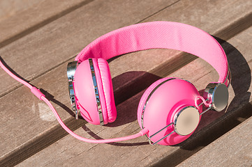 Image showing Vivid pink wired headphones