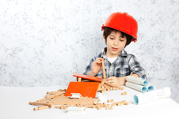 Image showing boy plans to build a house