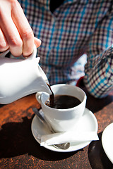 Image showing Pouring black filter coffee