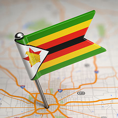 Image showing Zimbabwe Small Flag on a Map Background.