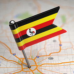 Image showing Uganda Small Flag on a Map Background.