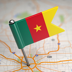 Image showing Cameroon Small Flag on a Map Background.