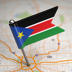 Image showing South Sudan Small Flag on a Map Background.