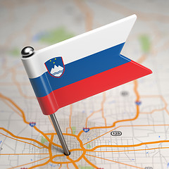 Image showing Slovenia Small Flag on a Map Background.