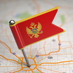 Image showing Montenegro Small Flag on a Map Background.