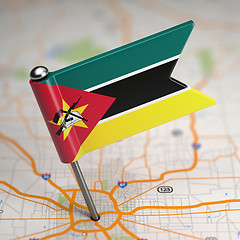 Image showing Mozambique Small Flag on a Map Background.