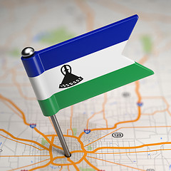 Image showing Lesotho Small Flag on a Map Background.