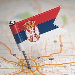 Image showing Serbia Small Flag on a Map Background.