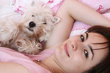 Image showing Dog sleeping on bed 