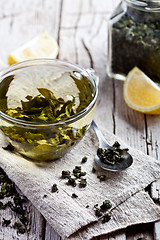 Image showing cup of green tea and lemon 