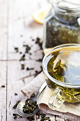 Image showing cup of green tea and lemon 