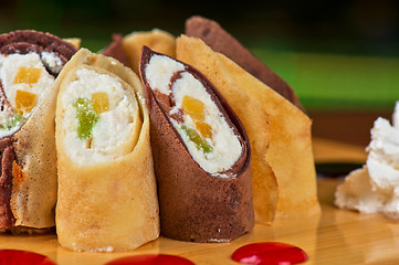 Image showing pancake roll with marmalade