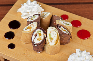 Image showing pancake roll with marmalade