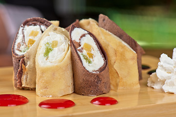 Image showing pancake roll with marmalade