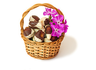 Image showing Chocolates in a wattled basket on a white background.